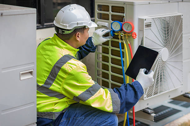 Professional Heat Pump Repair technician working in Wellsville, UT